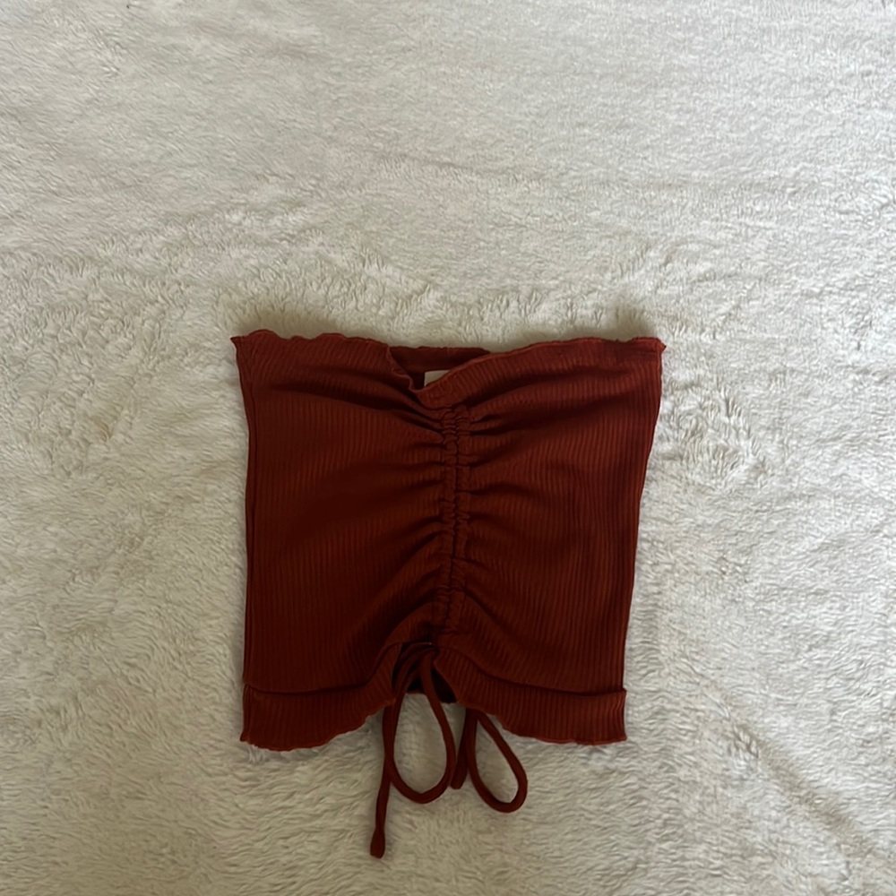 crop top without straps and was never worn with the brand tag on